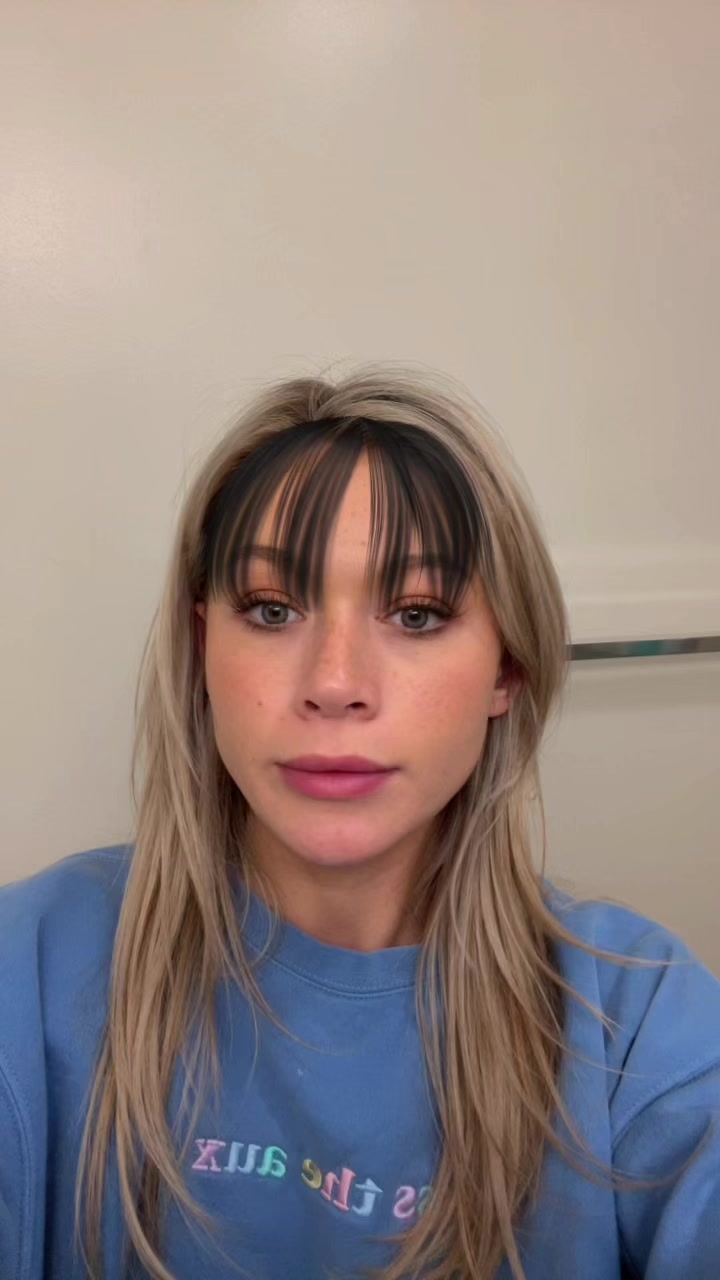 Bangs Filter: a frame of a post of the trend by @audreytrullinger on TikTok