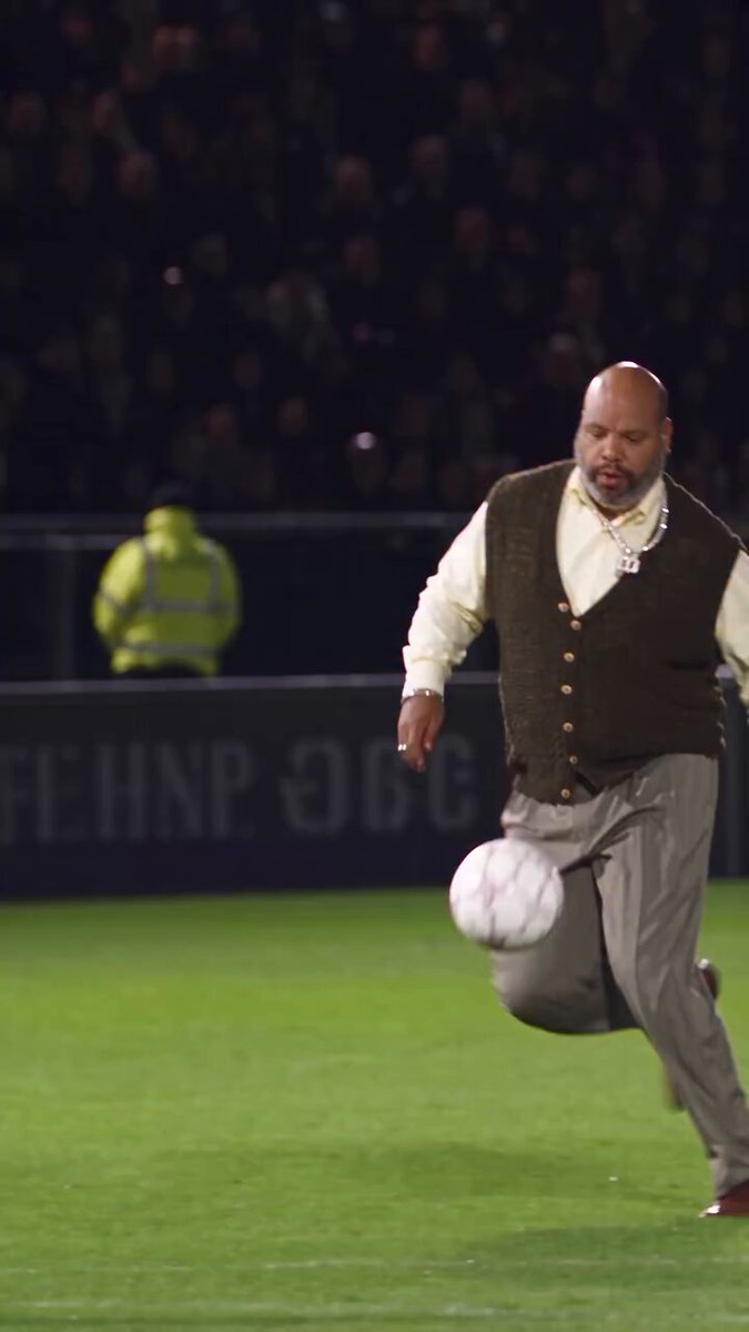 A frame of the Uncle Phil version of the Ozil goal AI trend, posted by @bootifulgame on X: an AI-made Uncle Phil running onto the ball in a floodlit stadium