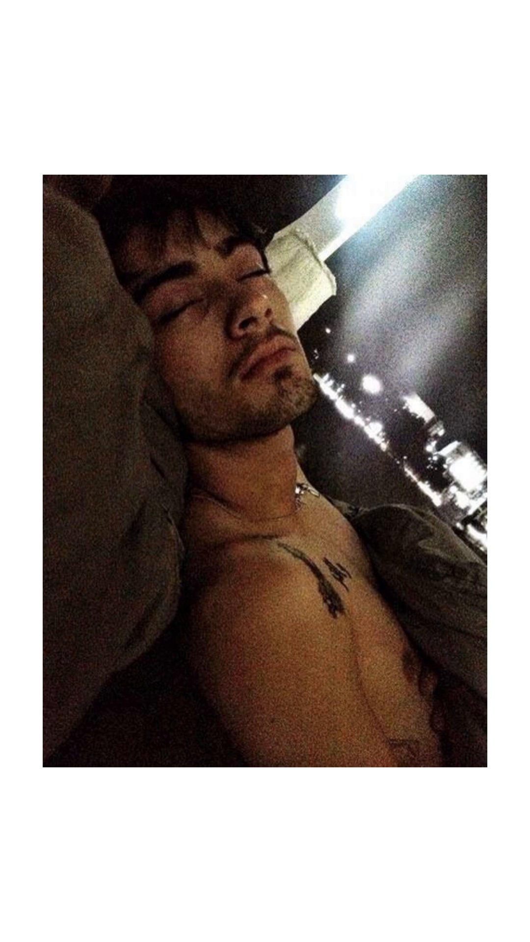 A frame of the original Zayn Malik sleeping slideshow by @timmy.thick47 on TikTok: its first slide, the old photo of Zayn asleep